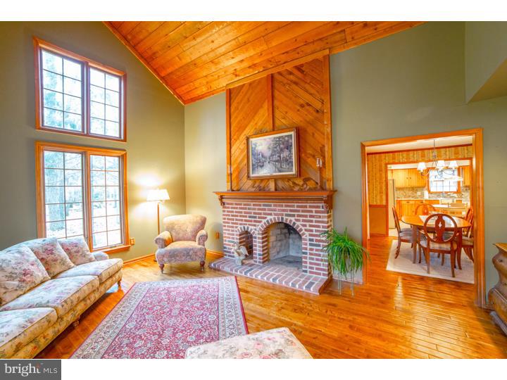 11 Foxchase Road Tabernacle, NJ 08088 - Photo 3 of 25 a living room with furniture a rug and a fireplace
