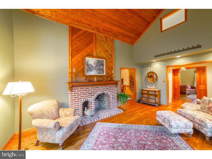 11 Foxchase Road Tabernacle, NJ 08088 - Photo 4 of 25 a living room with furniture and a fireplace