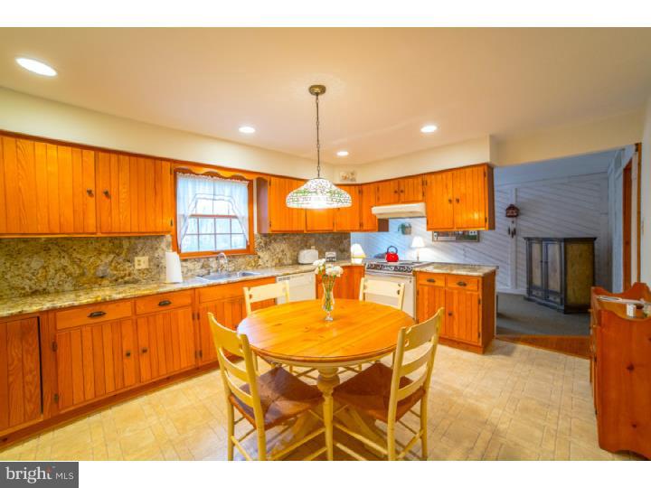 11 Foxchase Road Tabernacle, NJ 08088 - Photo 7 of 25 a dining hall with stainless steel appliances a dining table and chairs