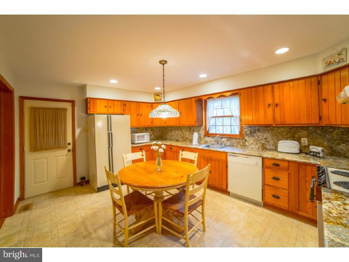 11 Foxchase Road Tabernacle, NJ 08088 - Photo 8 of 25 a kitchen with stainless steel appliances granite countertop a sink and a refrigerator