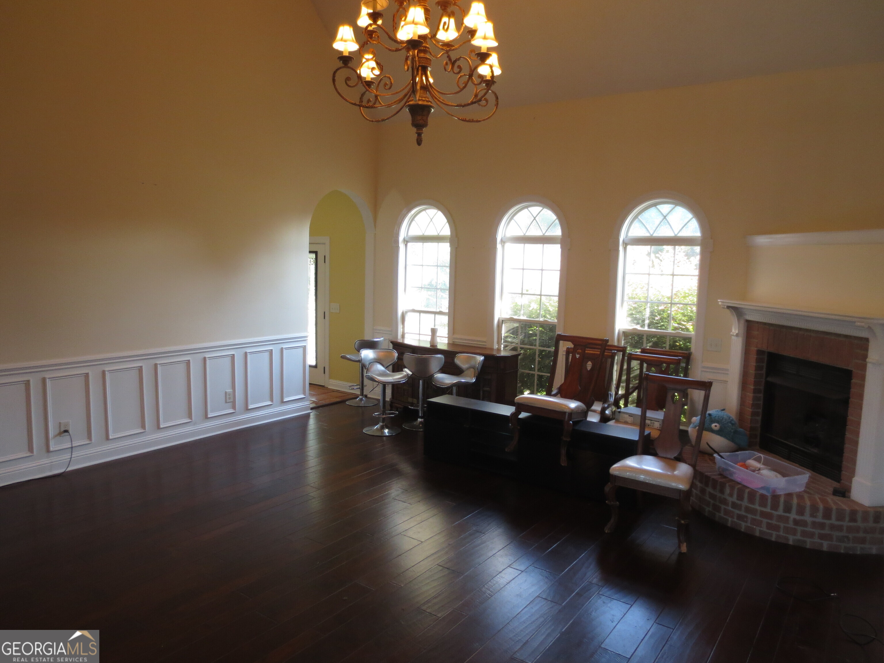 184 Giles Road Warner Robins, GA 31093 - Photo 11 of 31 a living room with fireplace furniture and a large window