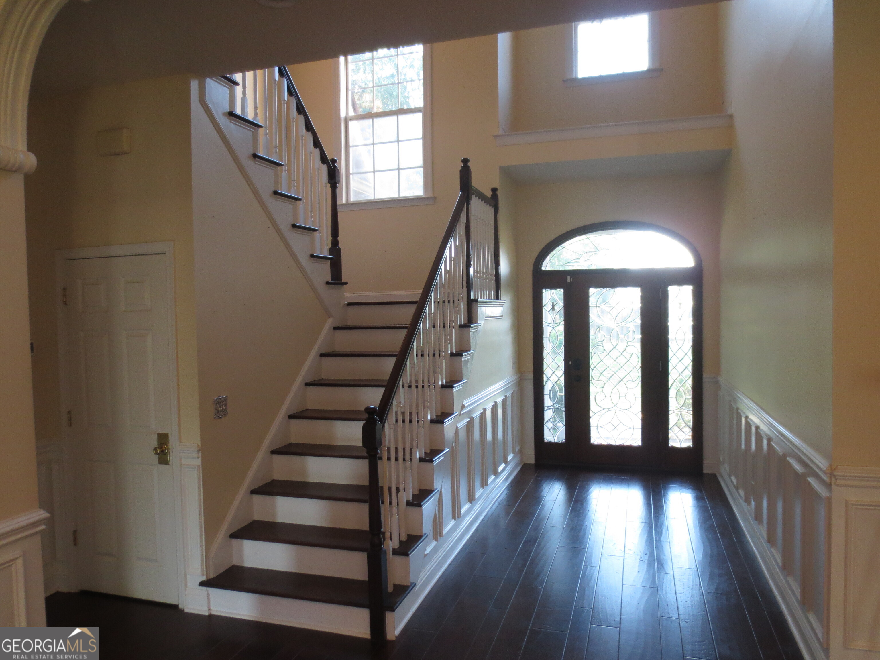 184 Giles Road Warner Robins, GA 31093 - Photo 12 of 31 a view of staircase with wooden floor and fan