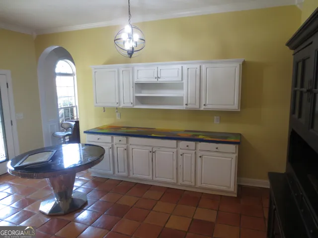 a kitchen with a sink and cabinets