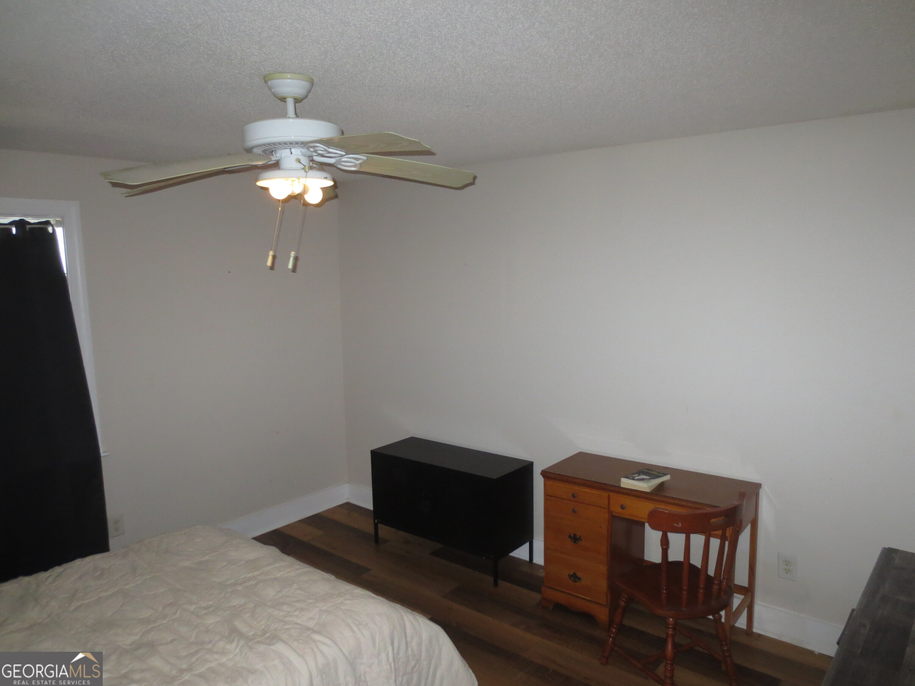 184 Giles Road Warner Robins, GA 31093 - Photo 19 of 31 a bedroom with a bed and a chandelier