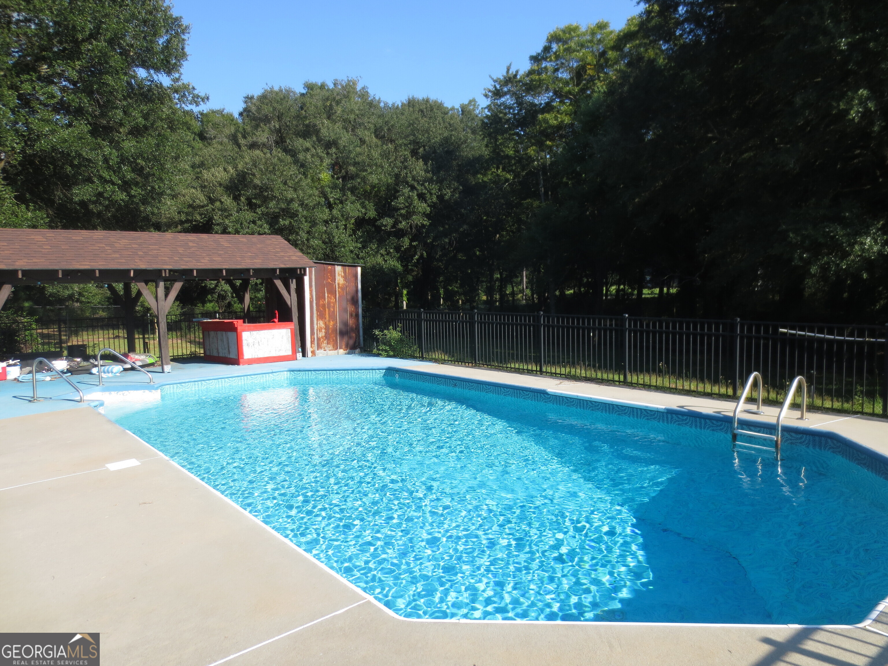 184 Giles Road Warner Robins, GA 31093 - Photo 2 of 31 a view of a swimming pool with a patio
