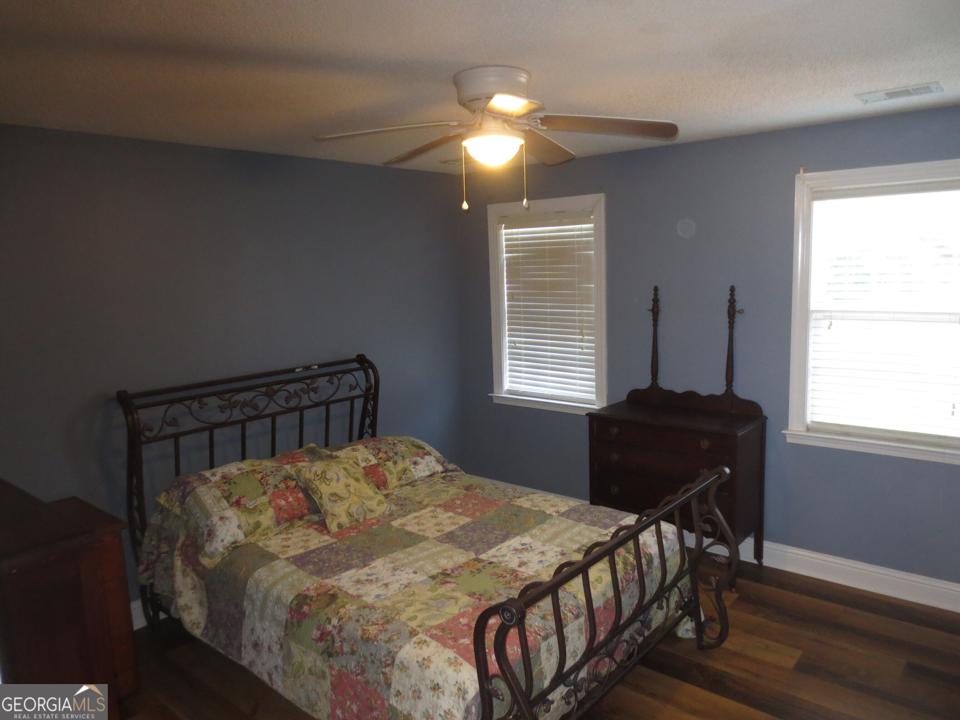 184 Giles Road Warner Robins, GA 31093 - Photo 23 of 31 a bedroom with a bed and a window