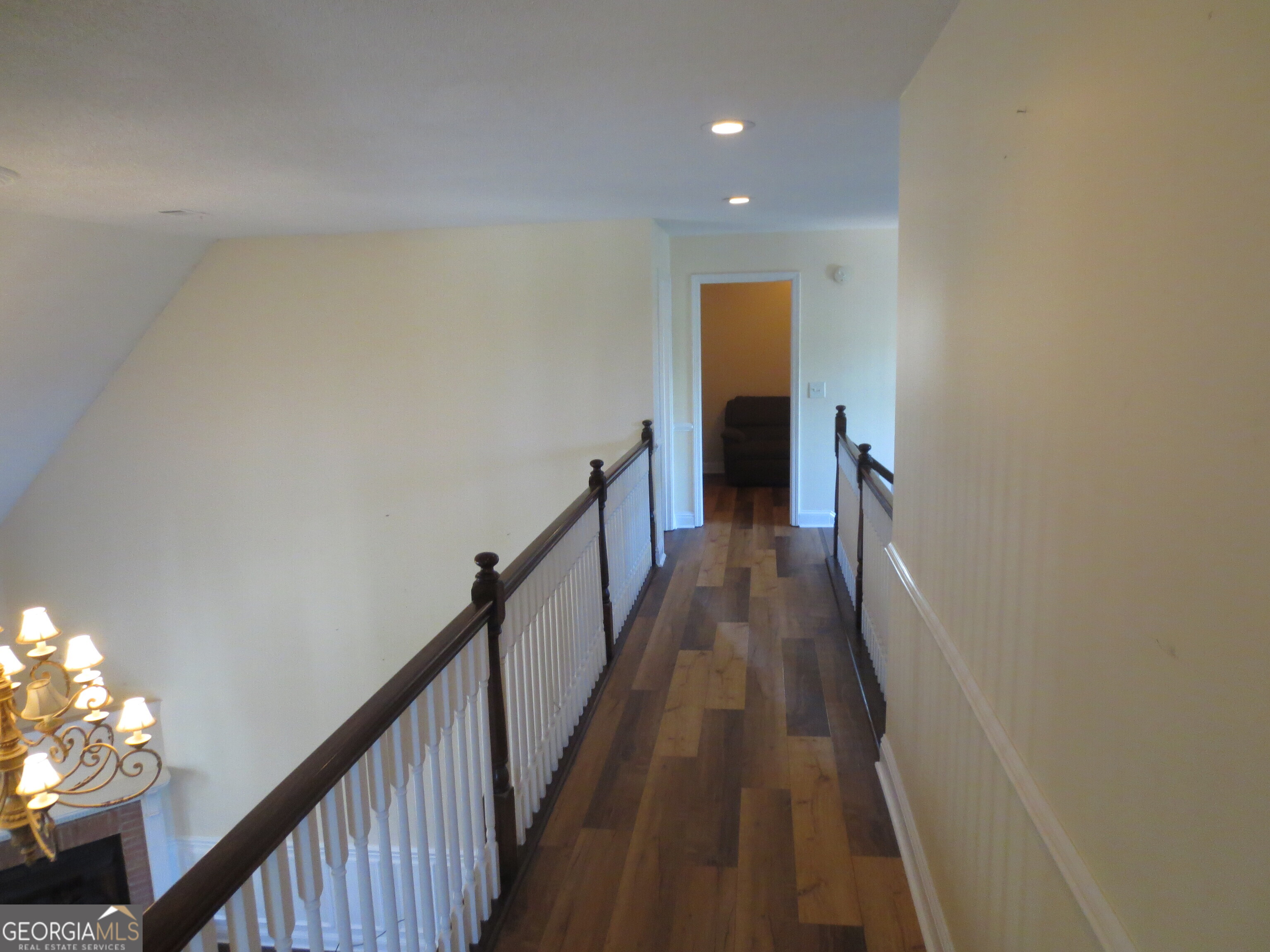184 Giles Road Warner Robins, GA 31093 - Photo 25 of 31 a view of a hallway with wooden floor and stairs