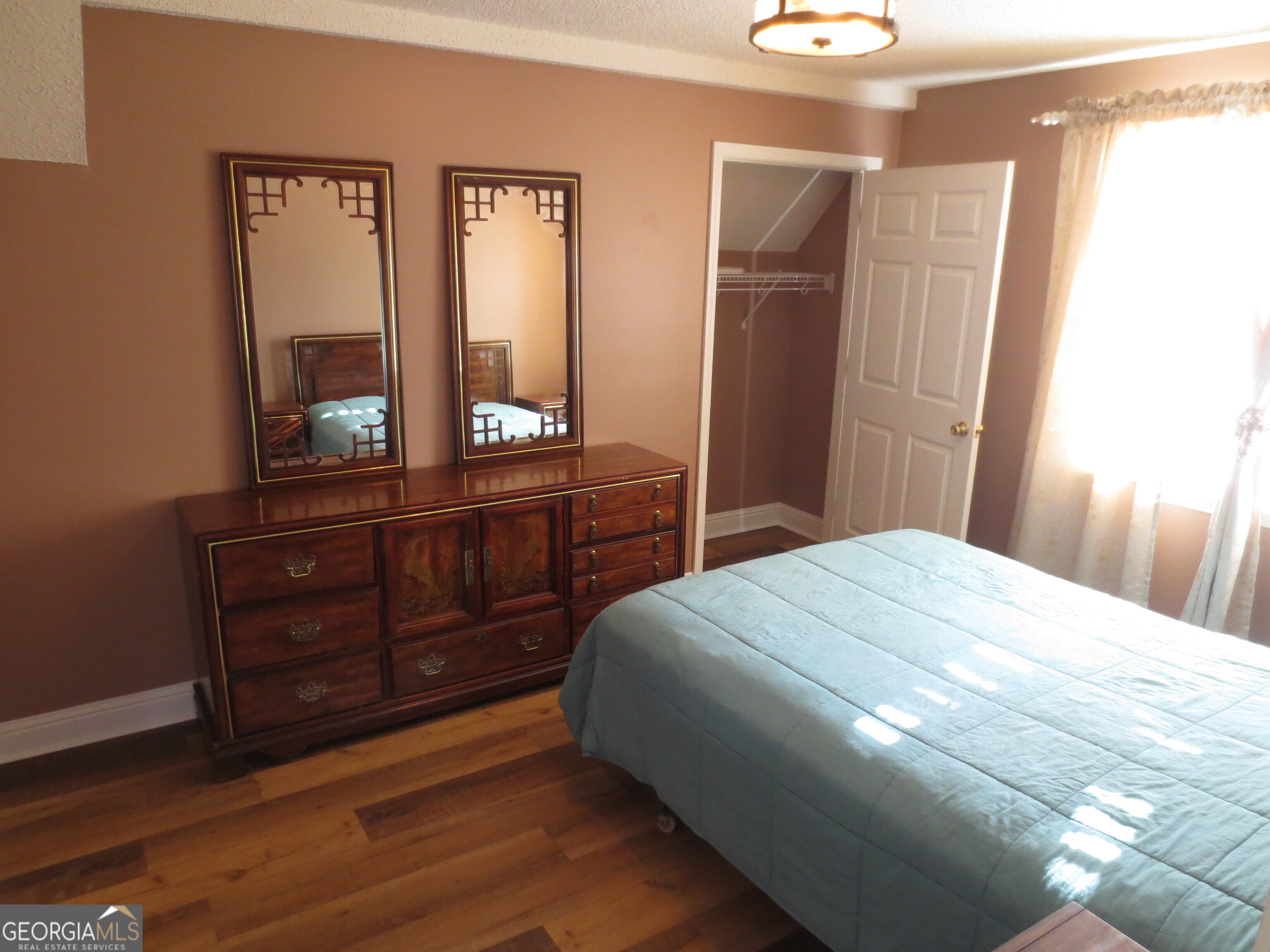 184 Giles Road Warner Robins, GA 31093 - Photo 26 of 31 a bedroom with a bed and a dresser