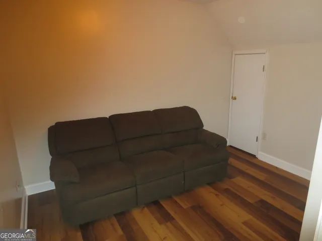 a view of a park with large trees