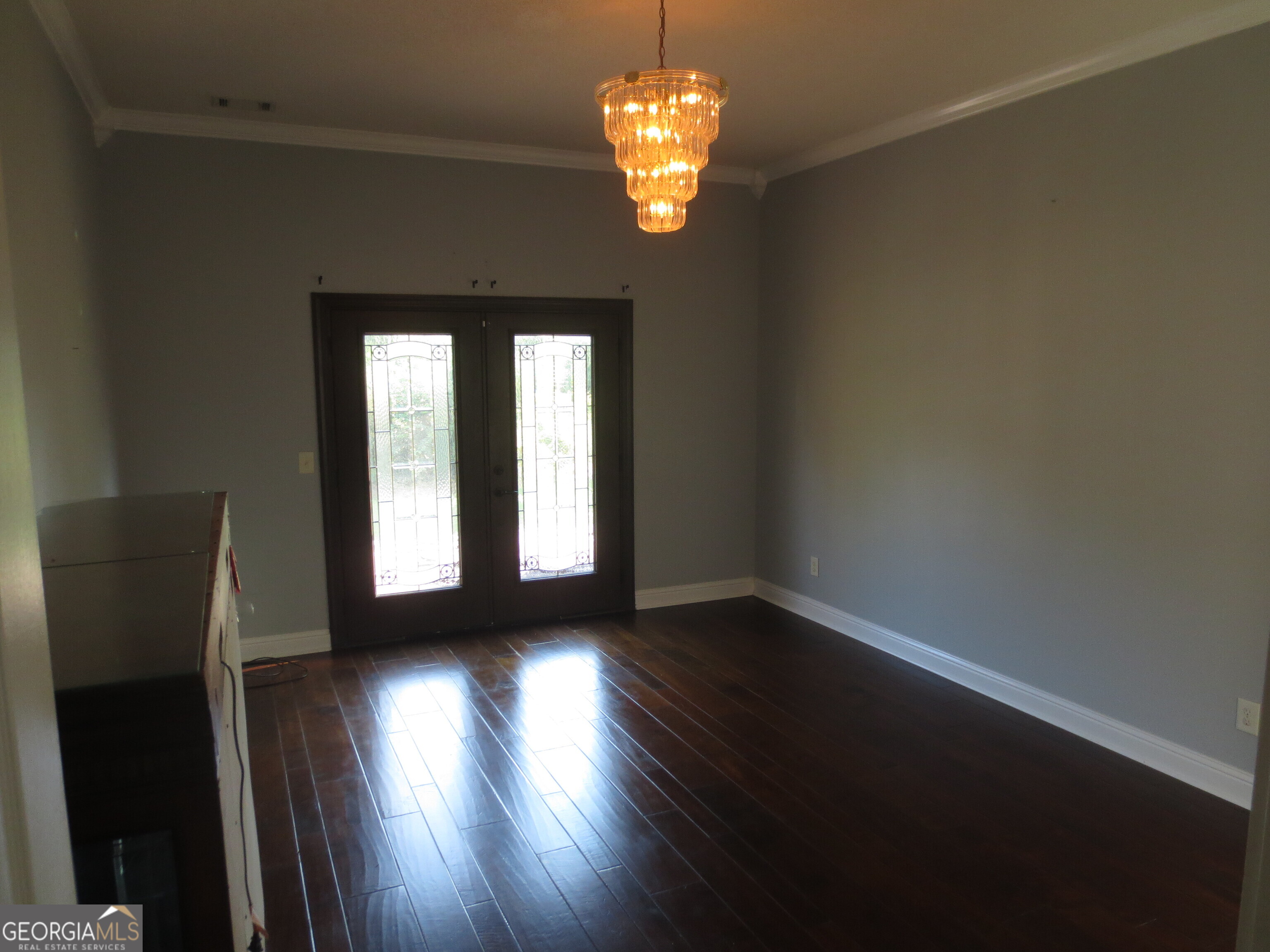 184 Giles Road Warner Robins, GA 31093 - Photo 6 of 31 a view of a livingroom with wooden floor and a window