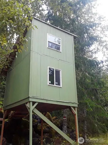 a view of outdoor space with a garden and trees