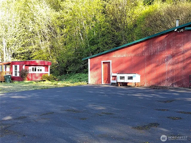 a view of a street with potted plants