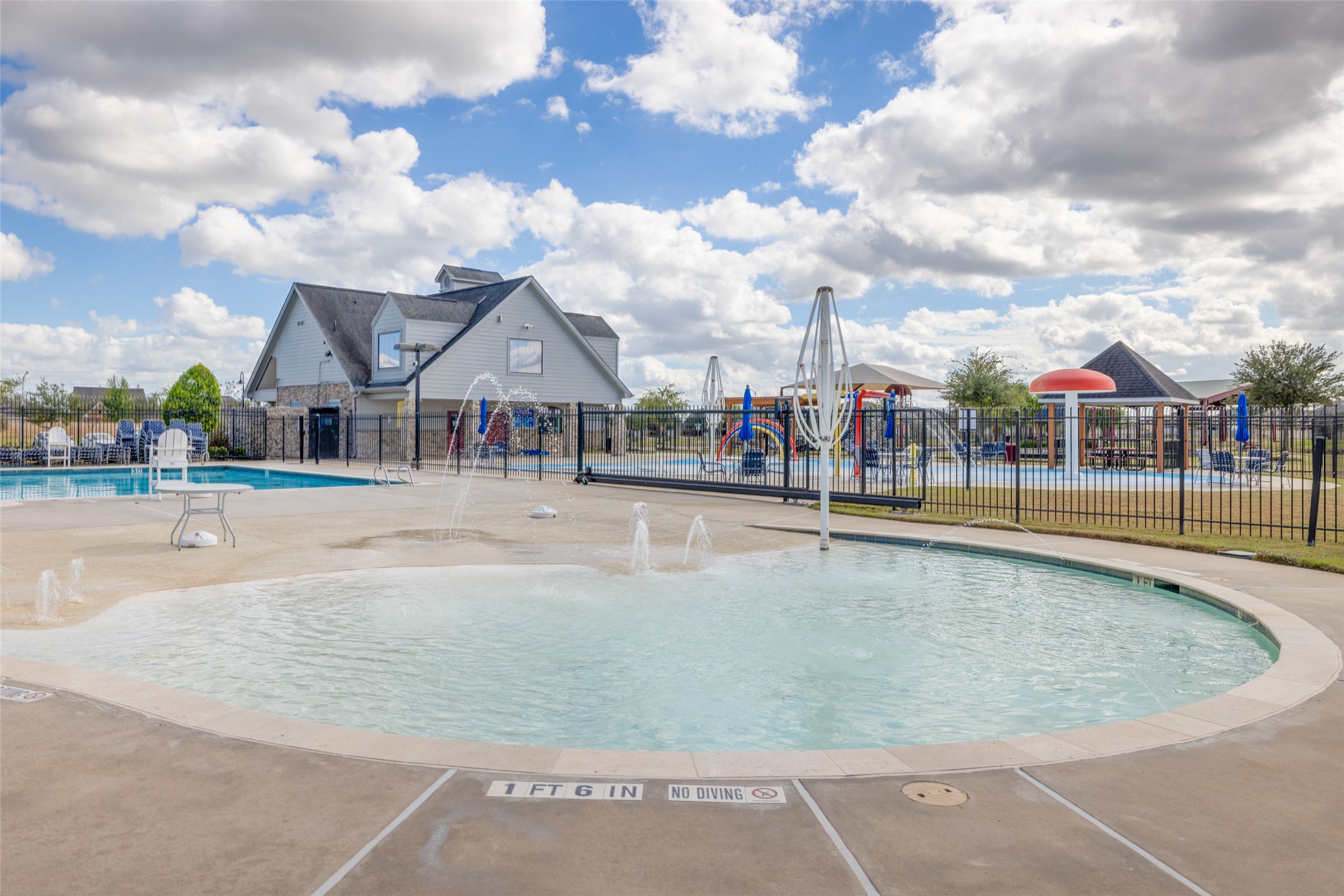 2503 American Ruby Drive Rosharon, TX 77583 - Photo 23 of 30 a view of a swimming pool and a houses