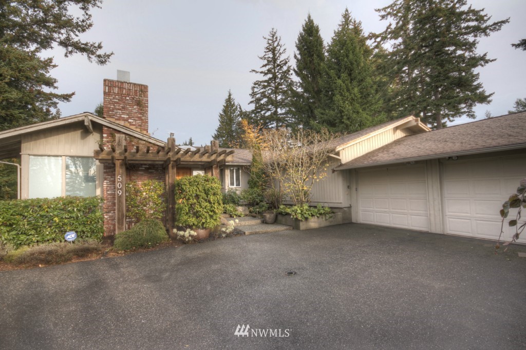 509 Bayside Road Bellingham, WA 98225 - Photo 2 of 17 a view of a house with a yard and garage