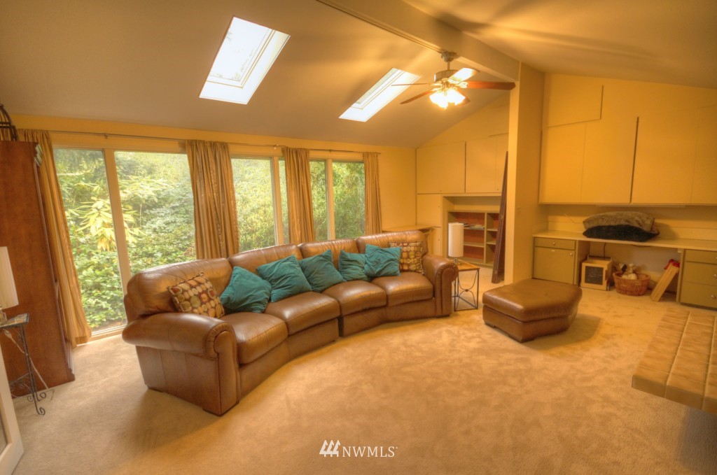 509 Bayside Road Bellingham, WA 98225 - Photo 7 of 17 a living room with furniture and large windows