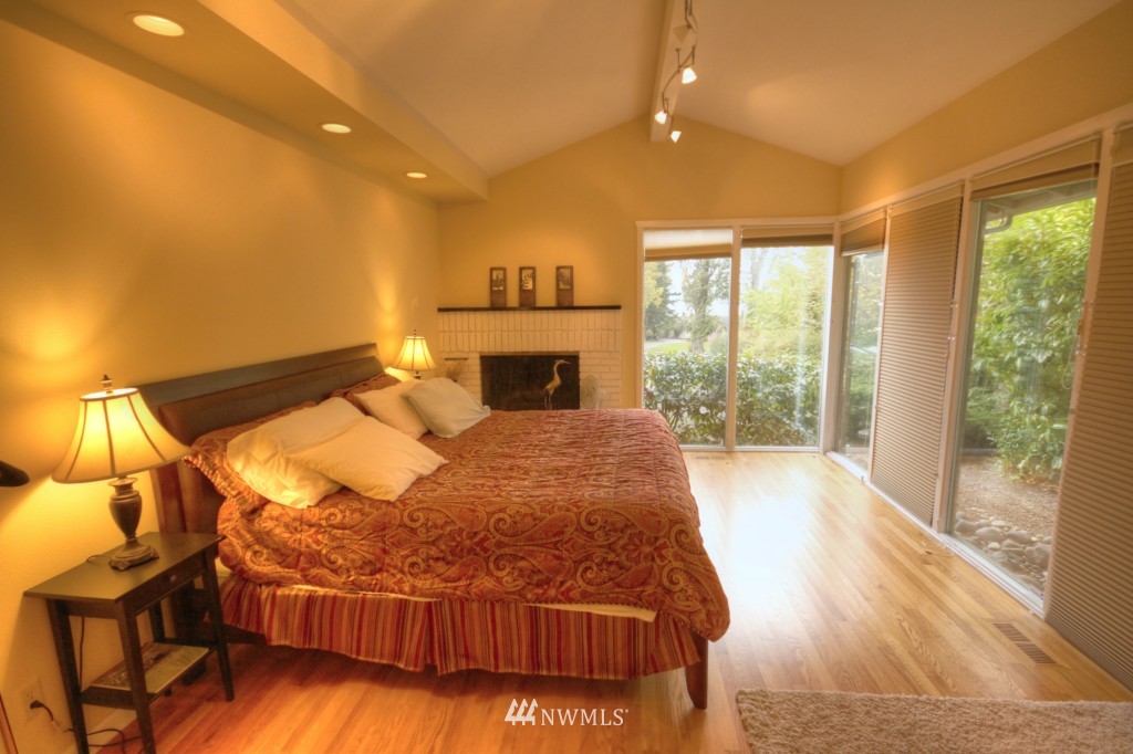 509 Bayside Road Bellingham, WA 98225 - Photo 9 of 17 a bed sitting in a room next to a window