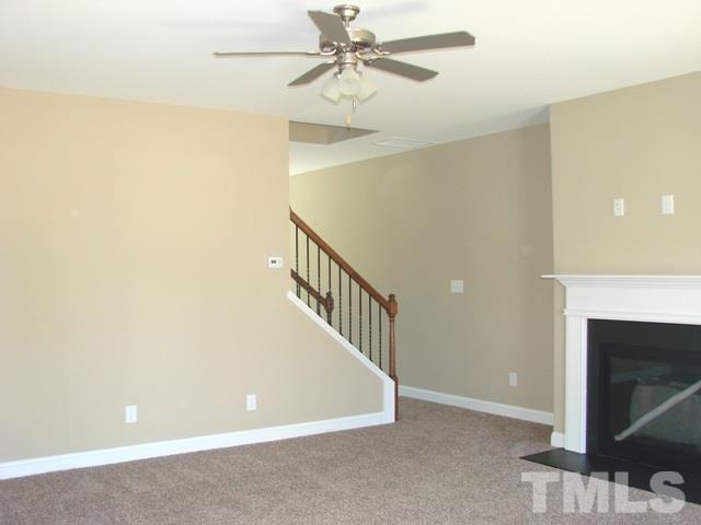 2214 Flowing Drive Raleigh, NC 27610 - Photo 5 of 14 a view of a livingroom with a ceiling fan and ceiling fan