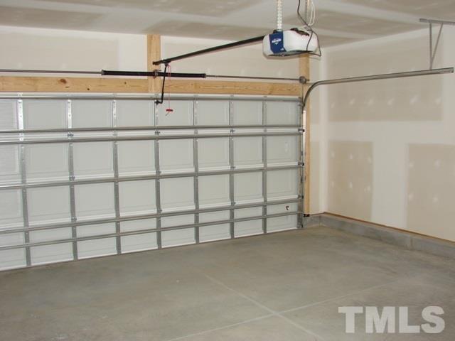 2214 Flowing Drive Raleigh, NC 27610 - Photo 8 of 14 a view of a room with racks on the wall