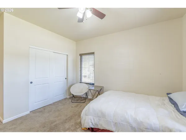 a bedroom with a bed and window