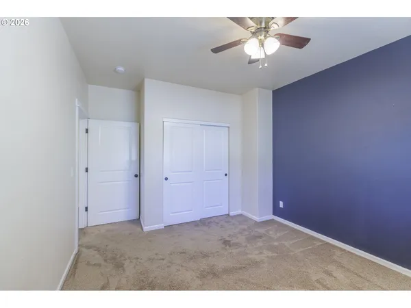 a view of a chandelier fan in a room
