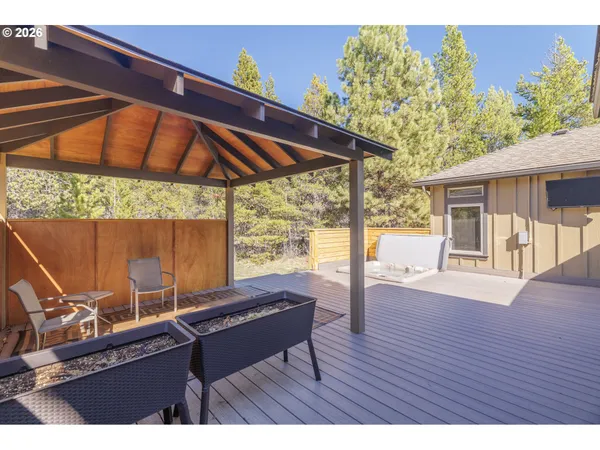 a view of a house with pool table and chairs