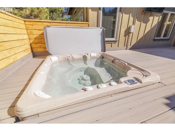 a view of a grey house with a yard