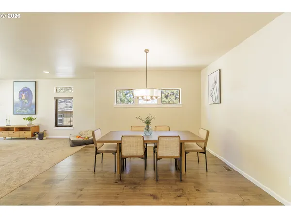 a dining room with furniture and window