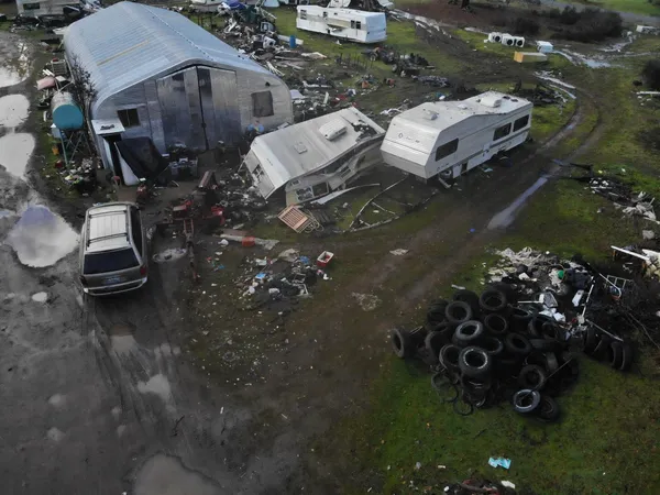an aerial view of a house with a yard
