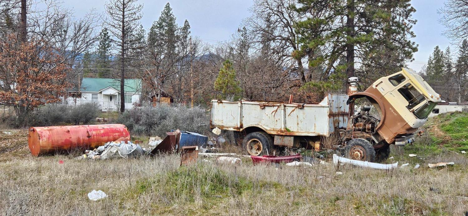 1240 Morgan Hill Road Hayfork, CA 96041 - Photo 13 of 25 a backyard of a house with table and chairs