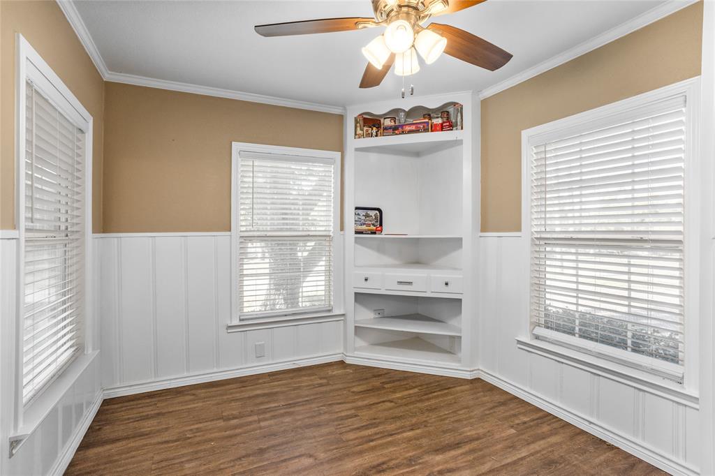 1825 North Highland Avenue Sherman, TX 75092 - Photo 13 of 38 a view of a livingroom with wooden floor and a ceiling fan
