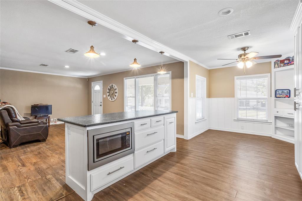 1825 North Highland Avenue Sherman, TX 75092 - Photo 15 of 38 a kitchen with stainless steel appliances granite countertop a stove and a refrigerator
