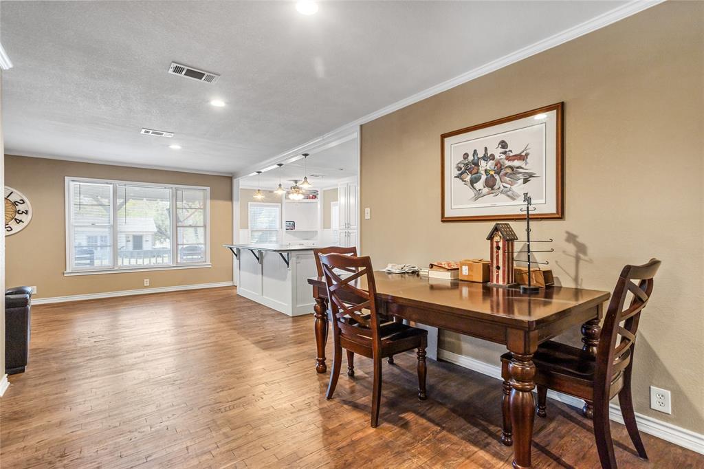 1825 North Highland Avenue Sherman, TX 75092 - Photo 17 of 38 a view of a dining room with furniture and wooden floor