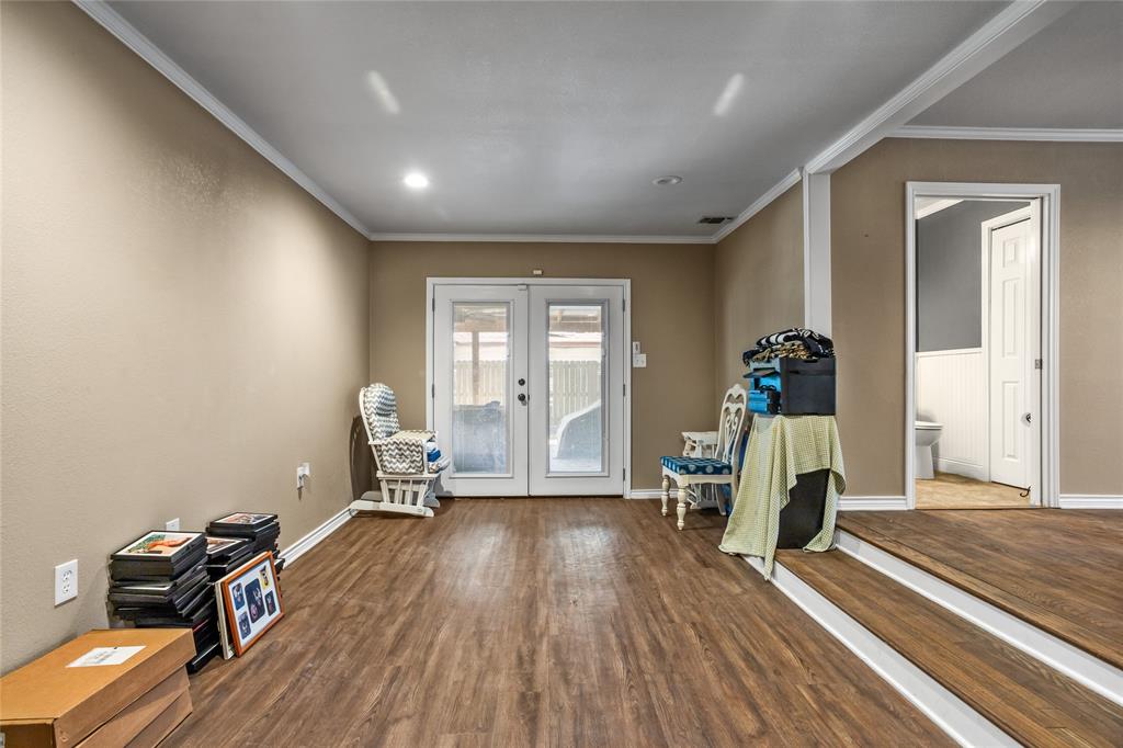 1825 North Highland Avenue Sherman, TX 75092 - Photo 19 of 38 a living room with furniture and a wooden floor