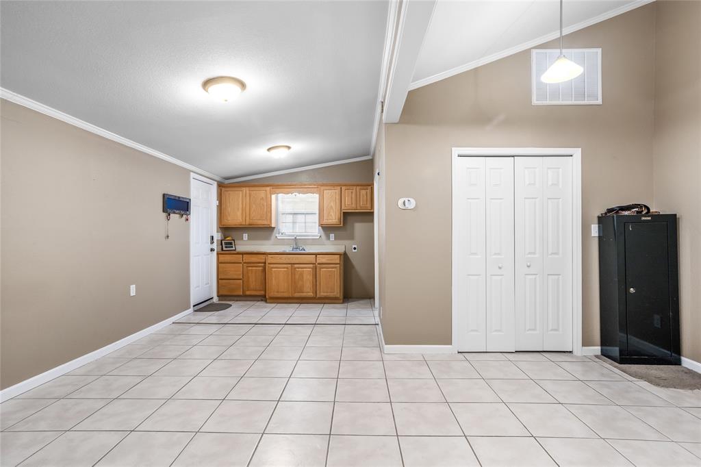1825 North Highland Avenue Sherman, TX 75092 - Photo 21 of 38 a view of a kitchen with a sink and a refrigerator
