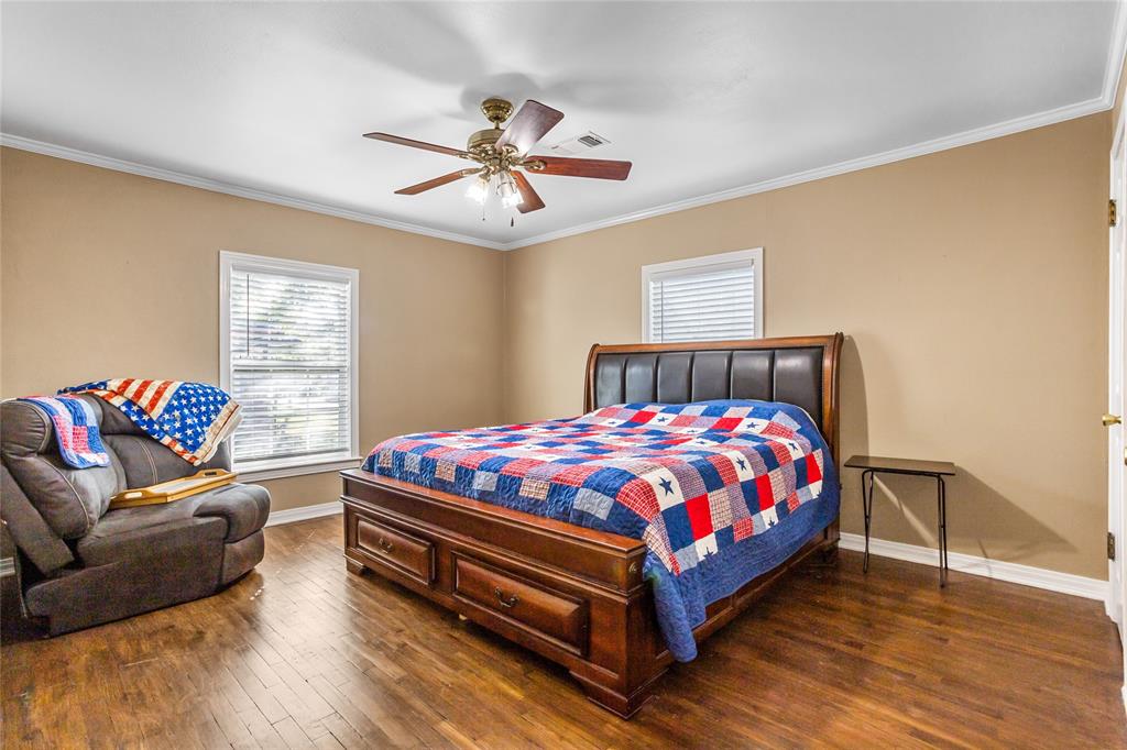 1825 North Highland Avenue Sherman, TX 75092 - Photo 24 of 38 a bedroom with a bed and window