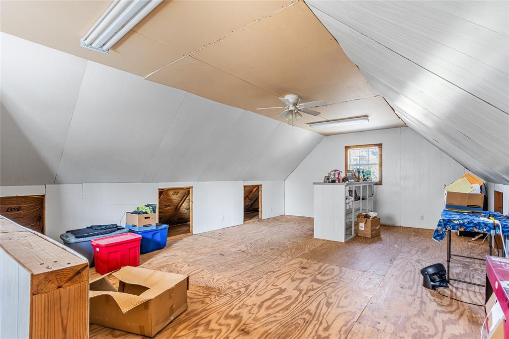 1825 North Highland Avenue Sherman, TX 75092 - Photo 34 of 38 a bedroom with furniture and a flat screen tv