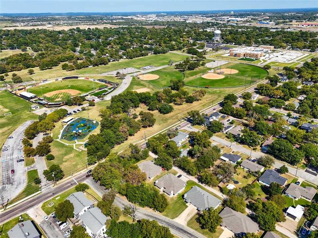 1825 North Highland Avenue Sherman, TX 75092 - Photo 36 of 38 an aerial view of residential houses with outdoor space