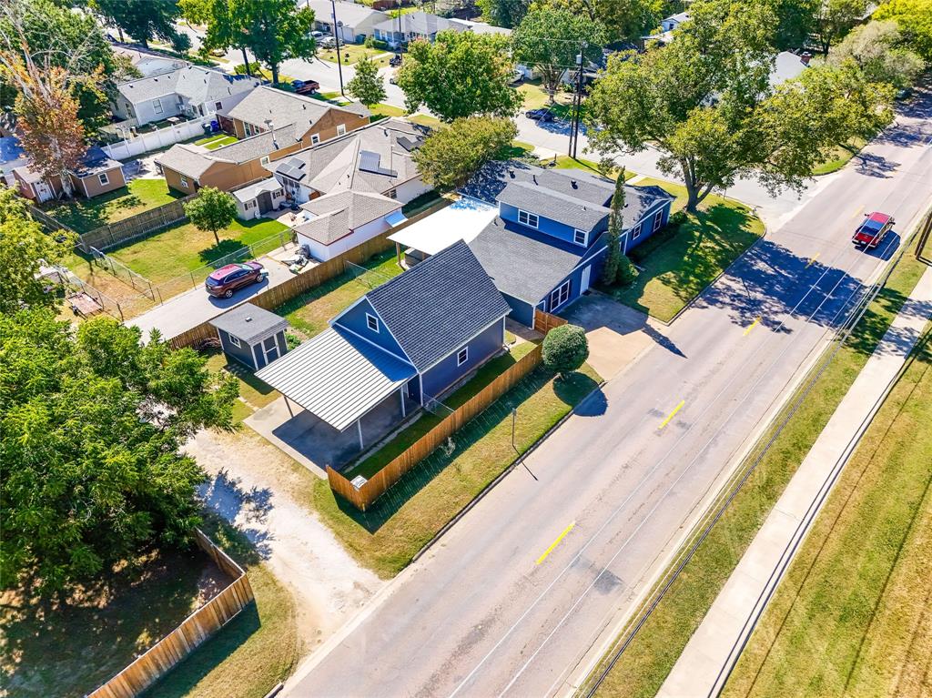 1825 North Highland Avenue Sherman, TX 75092 - Photo 7 of 38 an aerial view of a house with a garden
