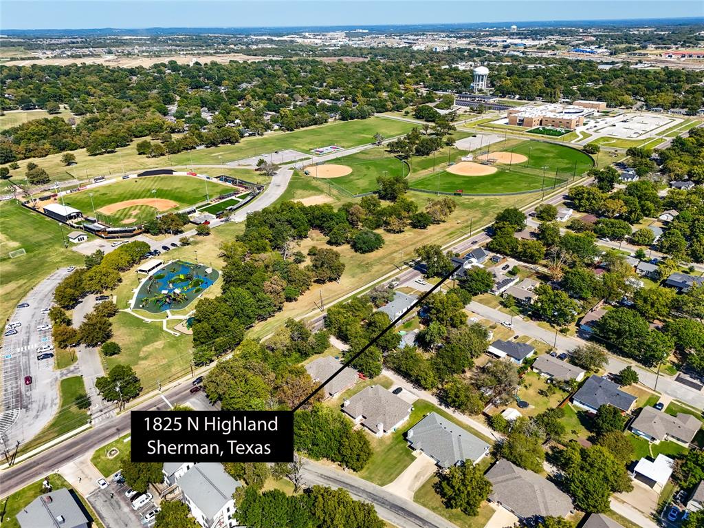 1825 North Highland Avenue Sherman, TX 75092 - Photo 8 of 38 an aerial view of residential houses with outdoor space