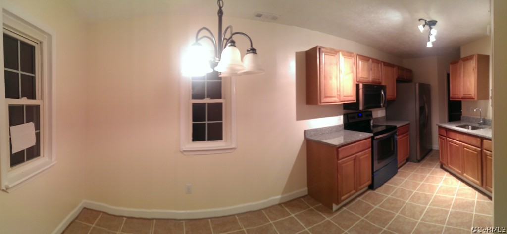 7748 Drexelbrook Road Chesterfield, VA 23832 - Photo 3 of 16 a kitchen with stainless steel appliances a refrigerator and a stove