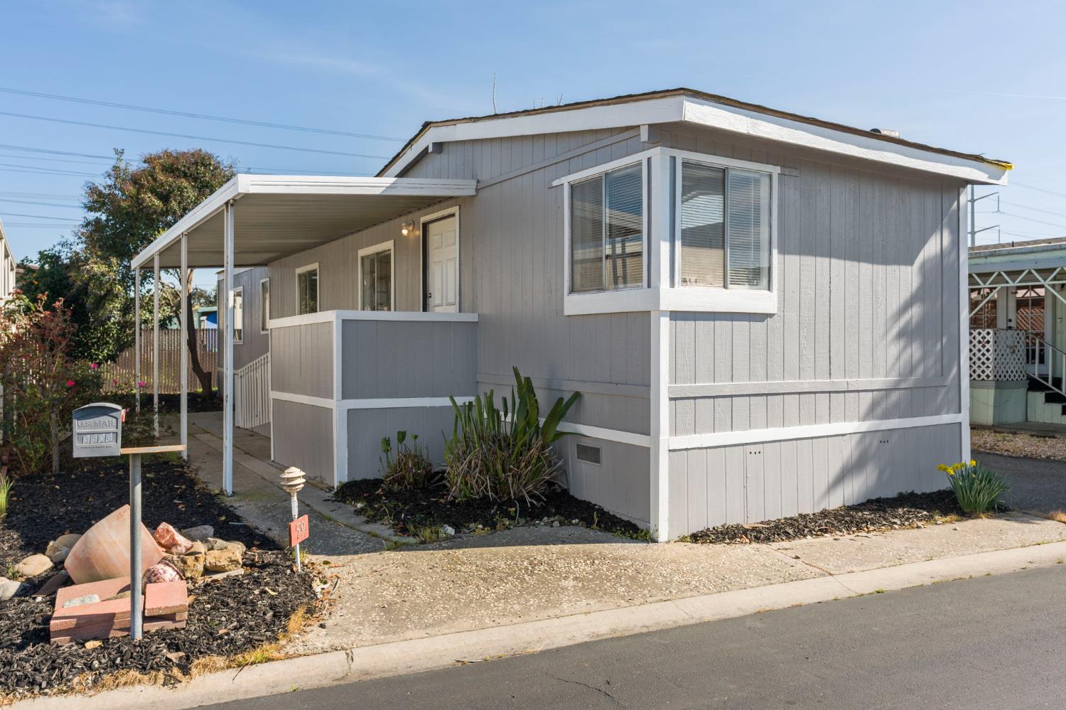 3550 Mitchell Road, Unit 59 Ceres, CA 95307 - Photo 1 of 18 a front view of a house with a yard