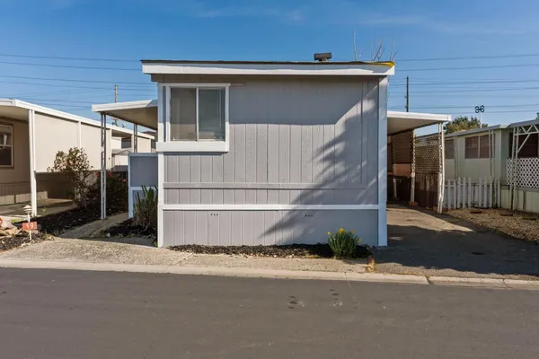 a front view of a house with a garage