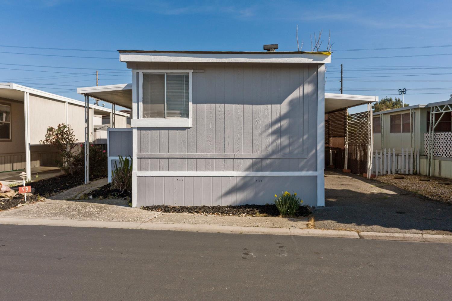 3550 Mitchell Road, Unit 59 Ceres, CA 95307 - Photo 2 of 18 a front view of a house with a garage
