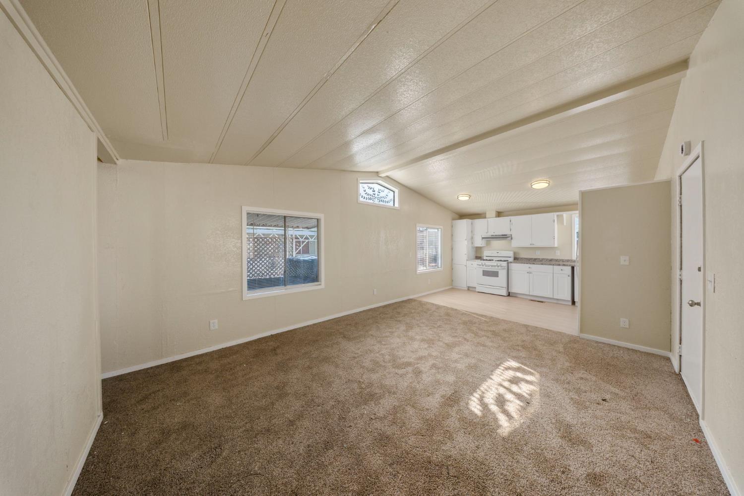 3550 Mitchell Road, Unit 59 Ceres, CA 95307 - Photo 7 of 18 a view of a livingroom and a kitchen
