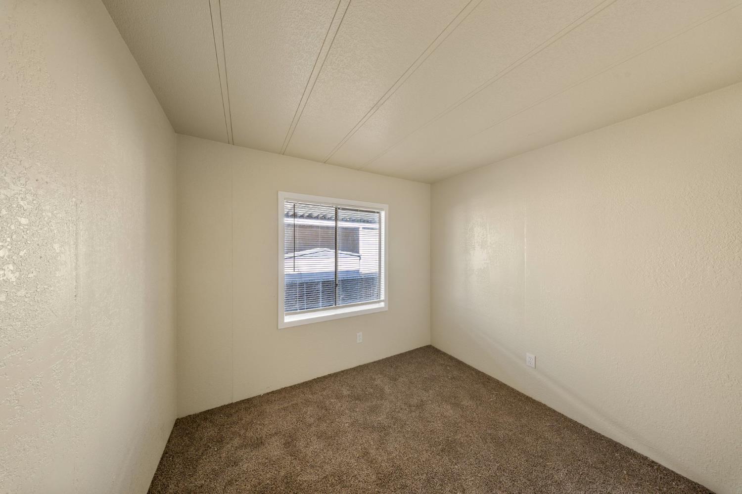 3550 Mitchell Road, Unit 59 Ceres, CA 95307 - Photo 10 of 18 an empty room with a window