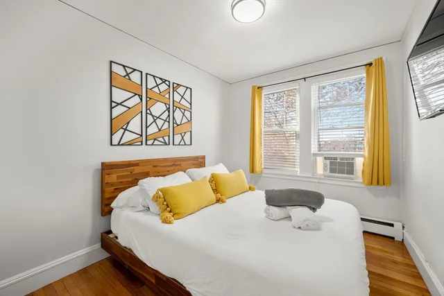 a view of a dining room with furniture and a large window