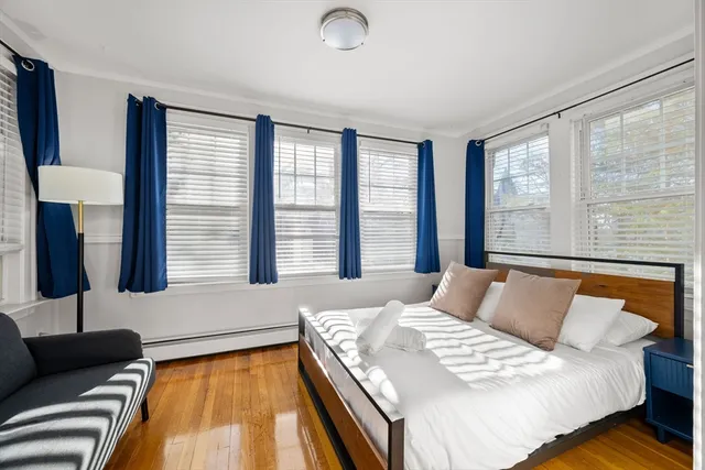 a large kitchen with stainless steel appliances granite countertop a sink a stove top oven a counter space and cabinets