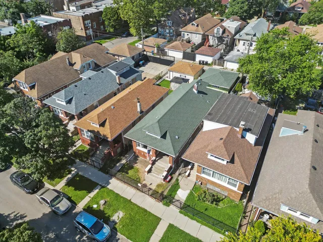 an aerial view of a house with a garden