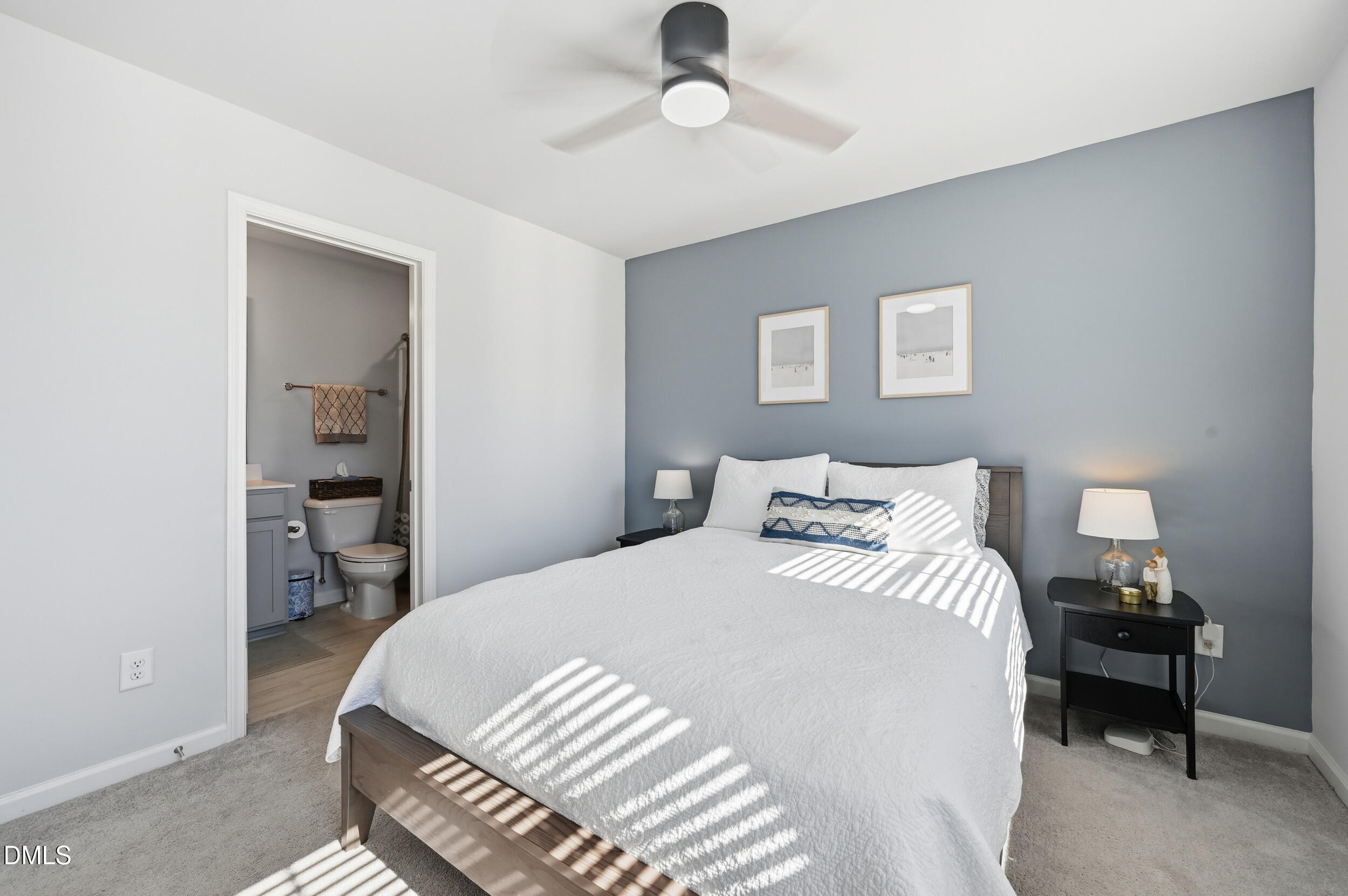 2536 Laurel Valley Way Raleigh, NC 27604 - Photo 12 of 16 a bedroom with a bed and a chandelier