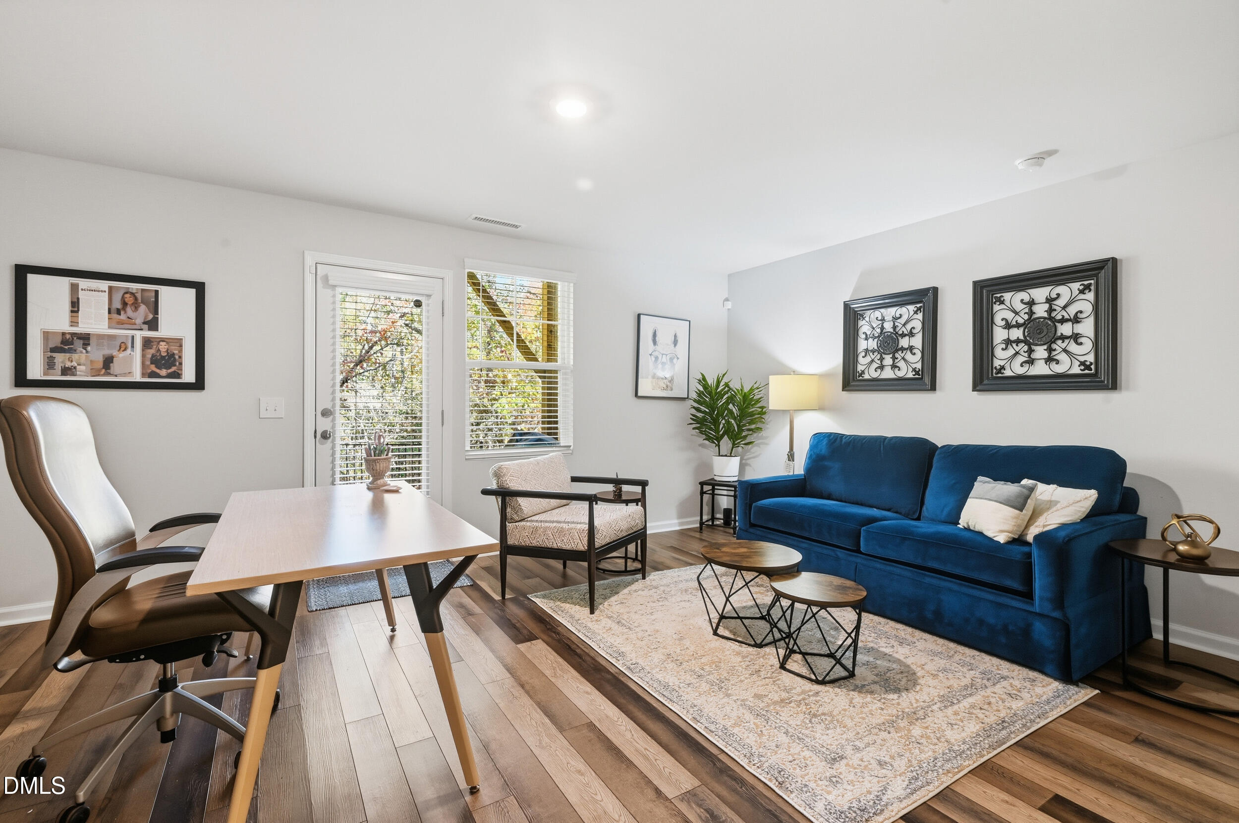 2536 Laurel Valley Way Raleigh, NC 27604 - Photo 14 of 16 a living room with furniture and a wooden floor